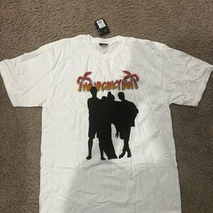 Stussy White Tee with Black Silhouette and Red Accents
